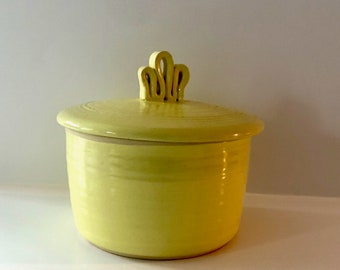 Signed small yellow casserole dish with lid