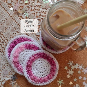 May include: A set of handmade crochet coasters in white and shades of pink, with a textured border. A glass of iced coffee with a straw sits on one coaster. The image includes the text "Digital Crochet Pattern".
