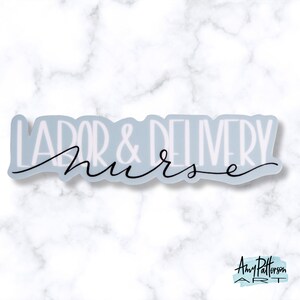 May include: A light blue sticker with the text "Labor & Delivery Nurse" in white lettering with a black cursive font.