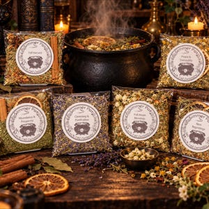 May include: Six clear plastic pouches containing dried botanical simmer pot ingredients, each with a round white label featuring a black cauldron illustration and text including Simmer Pot and Black Cat Curiosity, surrounding a black cast iron pot.
