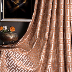 May include: Orange curtains with a geometric pattern of white squares on a brown background. The curtains are made of a soft, luxurious fabric and have a subtle sheen.