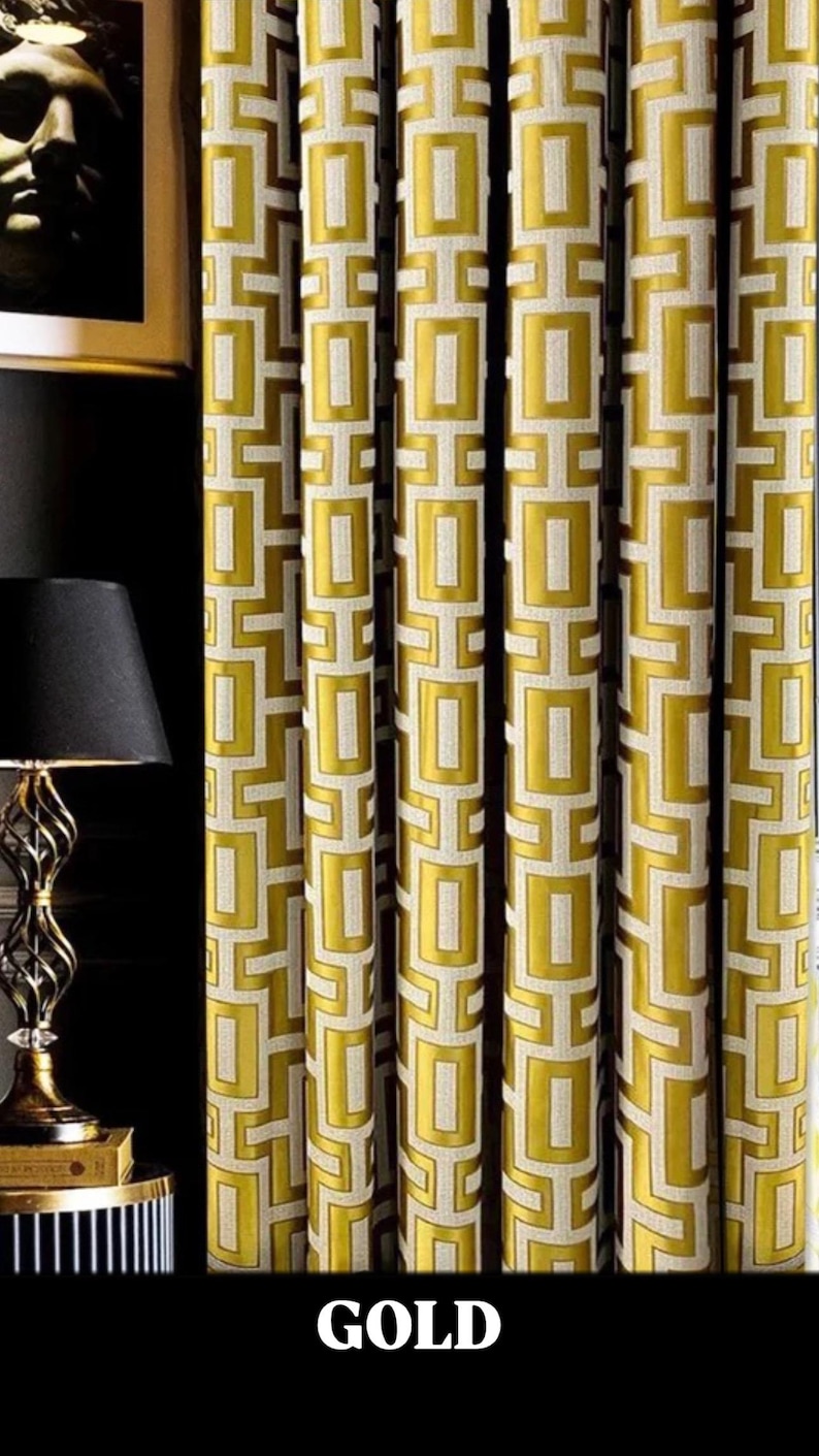 May include: Gold curtains with a geometric pattern of squares and rectangles. The curtains are made of a textured fabric and have a subtle sheen.