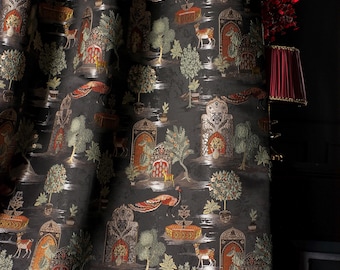 May include: Dark fabric with a detailed pattern featuring stylized trees, deer, and architectural elements in shades of green, gold, and orange against a black background. The design evokes a historical or exotic theme, suitable for home decor.