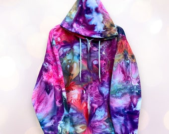 May include: A tie-dye zip-up hoodie with a colourful abstract pattern in shades of pink, purple, blue, and brown.