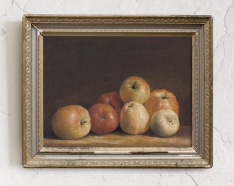 May include: A framed oil painting of a still life featuring a group of apples in various shades of red, yellow, and green. The apples are arranged on a wooden surface and are illuminated by a soft, warm light.