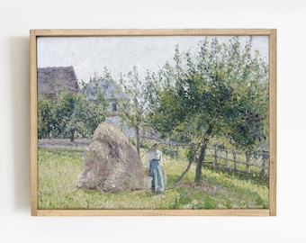 May include: A painting of a rural scene with a hay bale in a field, a woman standing near it, and a house in the background. The painting is framed in a light wood frame.