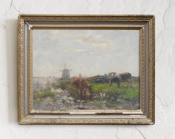 May include: A framed oil painting depicting a rural landscape with a windmill in the distance, cows grazing in a field, and a cloudy sky.