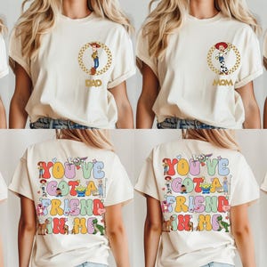 May include: Cream t-shirts with Toy Story character designs. Fronts show Bullseye, Dad, Mom, and Buzz Lightyear in gold circles. The backs display the phrase "YOU'VE GOT A FRIEND IN ME" with character illustrations.