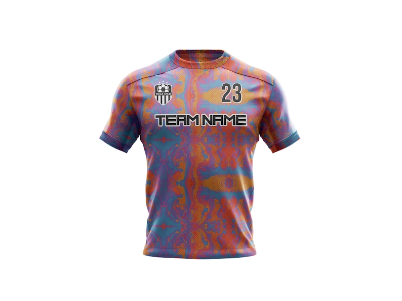 May include: A soccer jersey with a blue, orange, and pink abstract pattern. The jersey has a black team logo, the text "TEAM NAME", and the number "23" on the front.