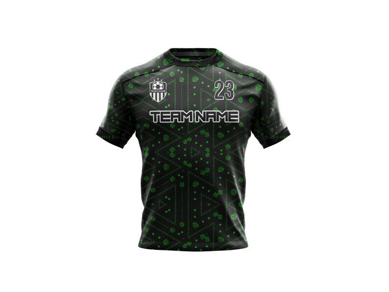 May include: Black and green soccer jersey with a geometric pattern. The jersey has a white team logo with a soccer ball and the text "TEAM NAME". The number "23" is on the front of the jersey.