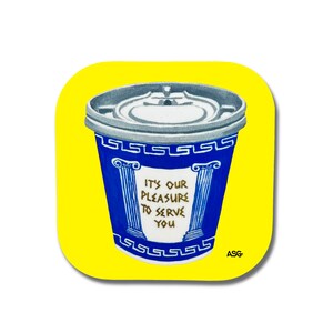 May include: A blue and white coffee cup with a gold inscription that reads "It's our pleasure to serve you". The cup is on a yellow background.