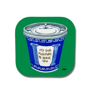 May include: A blue and white coffee cup with a gold Greek key design and the text "It's our pleasure to serve you". The cup is sitting on a green background.