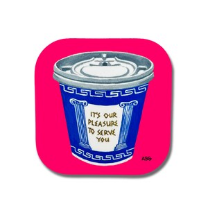 May include: A blue and white coffee cup with a gold Greek key design and the text "It's our pleasure to serve you". The cup is on a pink background.