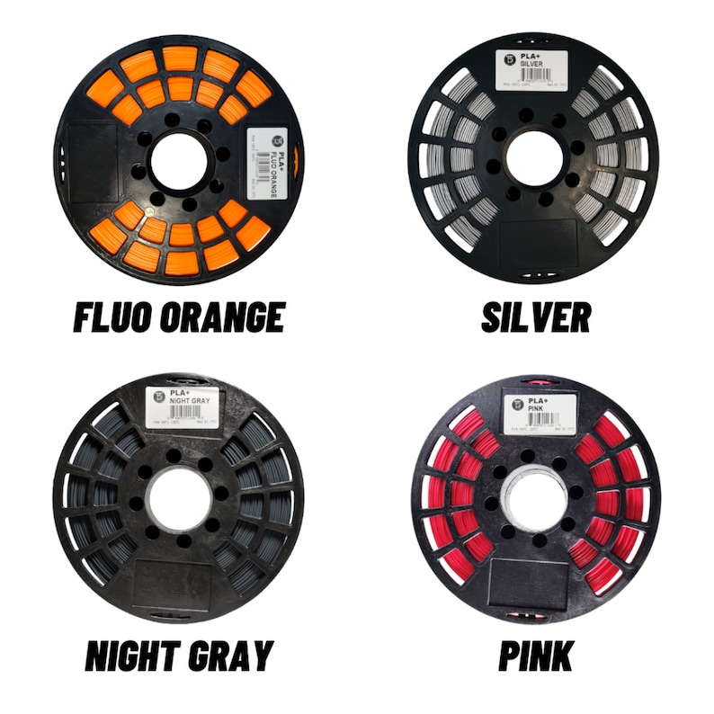 May include: Four spools of PLA+ filament in Fluorescent Orange, Silver, Night Gray, and Pink. Each spool is wound on a black plastic reel. The colors are labeled with bold text below each spool.