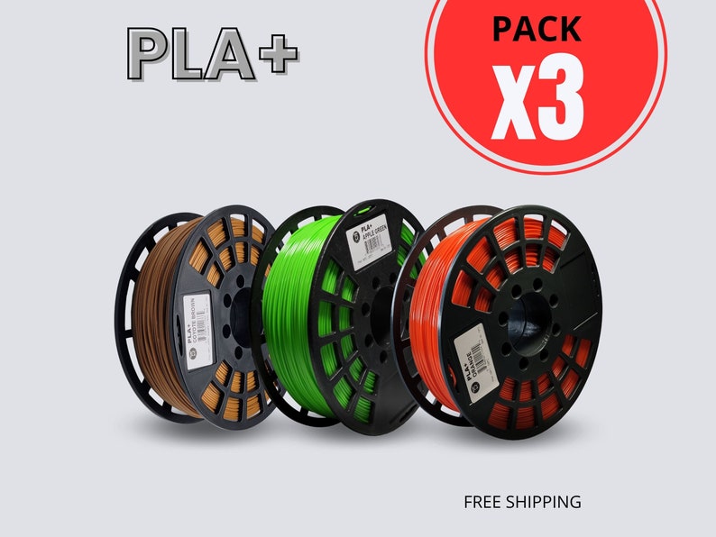 May include: Three spools of PLA+ filament in brown, green, and orange, each wound on a black spool. The image includes the text "PLA+" and "PACK X3" in a red circle. The words "FREE SHIPPING" are also visible.