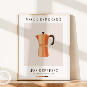 Puede incluir: Una impresión enmarcada con el texto "More Espresso, Less Depresso" y un gráfico de una cafetera. El texto debajo de la cafetera dice "My coffee is strong and so am I".