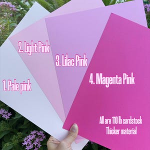 May include: Four sheets of cardstock in different shades of pink, from pale pink to magenta pink. The cardstock is 110 lb and is described as thicker material.