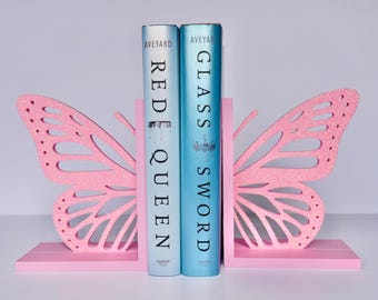 Sujetalibros de mariposa impresos en 3D: colores personalizados, acabado brillante, diseño entrelazado para decorar estanterías.