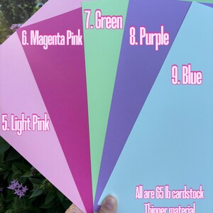May include: Five different colored cardstock paper samples in light pink, magenta pink, green, purple, and blue. All are 65 lb cardstock, thinner material.