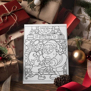 May include: A black and white coloring page featuring Santa Claus and an elf. Santa is holding a doll and the elf is holding a toy. The scene is set in front of a fireplace with stockings hanging from the mantle.