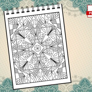 May include: A black and white geometric pattern coloring page with a spiral design in the center. The page is on a spiral bound notebook.