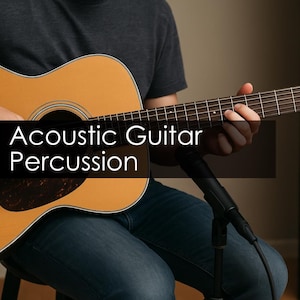 May include: Acoustic guitar with a natural wood finish, being played by a person wearing a gray shirt and blue jeans. The guitar has a dark brown pickguard and a microphone is positioned in front of it. Text on the image reads "Acoustic Guitar Percussion."