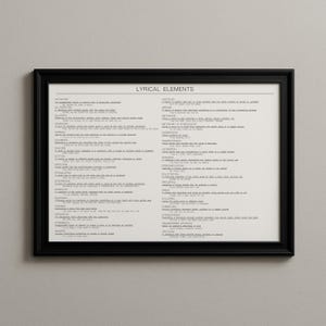 May include: A framed print with the words "LYRICAL ELEMENTS" at the top. The print has a white background with black text, listing various literary devices. The frame is black.