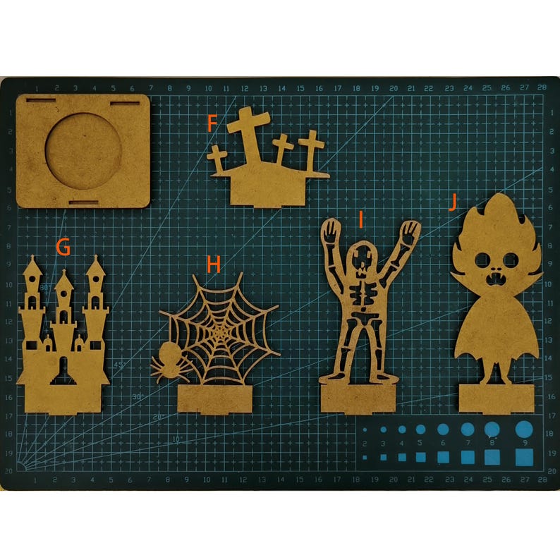 May include: A collection of laser-cut wooden Halloween decorations, including a castle, spiderweb with spider, skeleton, and a ghost-like figure. The pieces are various shapes and sizes, perfect for crafting or seasonal decor.
