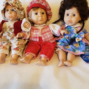 Three Gigo Expression Dolls