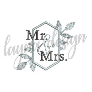 May include: A silver geometric frame with the text "Mr. & Mrs." inside. The frame is decorated with silver leafy branches.