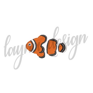 May include: Embroidered clownfish design in orange, white, and black. The fish has a distinctive pattern with a white stripe and black outlines. The design is on a white background. The word "layla design" is written in cursive.