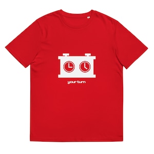 May include: Red t-shirt with a white graphic of a chess clock and the words "your turn" below. The chess clock graphic has two clock faces inside a white rectangular box.