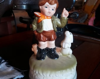 Musical figurine of boy and his dog