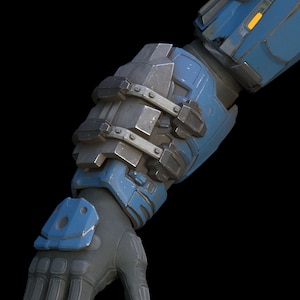 Puede incluir: Primer plano de un brazo robótico azul y gris con un diseño detallado. El brazo está hecho de metal y plástico y tiene una serie de articulaciones y engranajes.