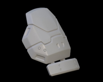 May include: A white plastic 3D printed model of a futuristic armor piece with a rectangular panel on the bottom.