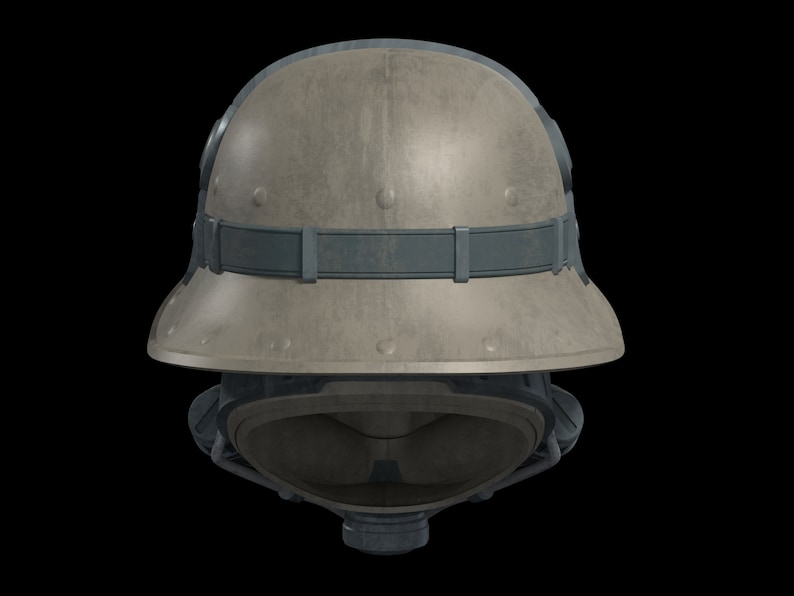 May include: A tan military helmet with a dark gray strap and a dark gray face mask. The helmet has a textured surface and a rounded shape.