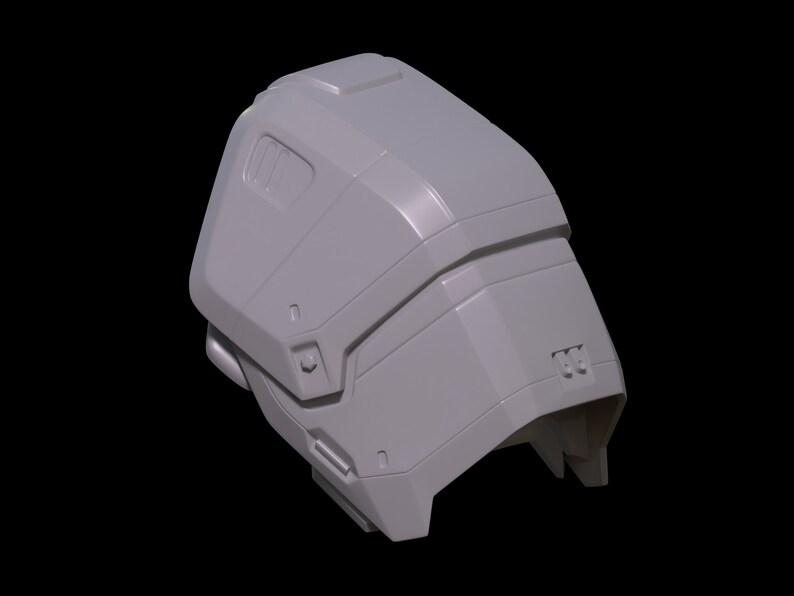 May include: A gray 3D printed model of a helmet with a futuristic design. The helmet has a smooth, rounded surface with several raised details and a small, rectangular window on the side.