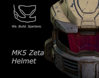 Puede incluir: Primer plano de un casco desgastado, de color beige y gris, con una visera roja. El casco tiene un fondo negro y el texto "MK5 Zeta Helmet" es visible debajo del casco.