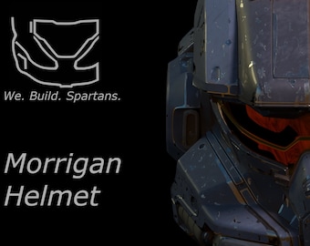 May include: A close-up of a dark blue and gray helmet with a red visor. The helmet has a weathered, worn look. The text "We. Build. Spartans." and "Morrigan Helmet" is visible below the helmet.