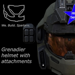 Puede incluir: Primer plano de un casco Grenadier con accesorios, en verde oscuro y negro. El casco tiene una visera color cobre y un emblema azul en forma de estrella que dice "PRO Series". También se ve el texto "We. Build. Spartans."