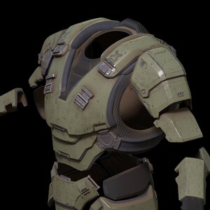 May include: A green and black futuristic armor set with multiple pieces, including a chest plate, shoulder pads, and arm guards. The armor has a worn and weathered look, suggesting it has been used in battle.