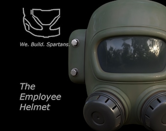 May include: A green gas mask with a clear visor and two round air filters. The text "The Employee Helmet" is written below the mask.