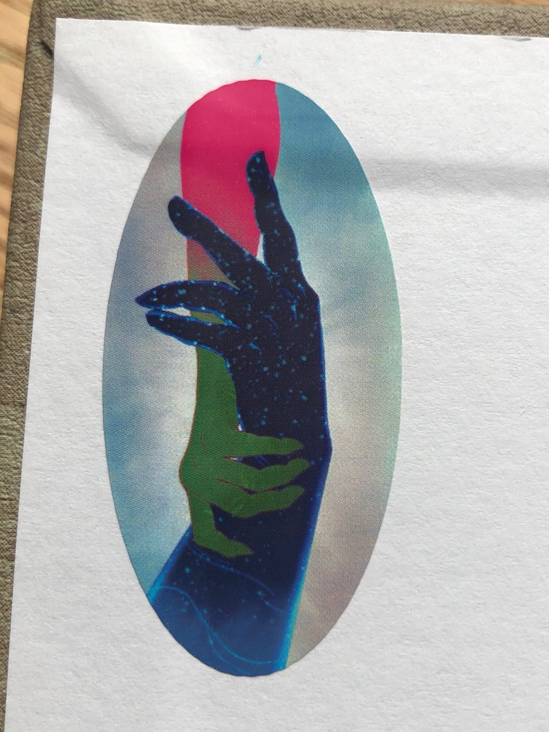 May include: A blue and green hand with a pink background. The hand is stylised and has a speckled texture.