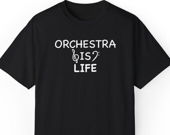 May include: Black t-shirt with the white text "ORCHESTRA IS LIFE" and a musical note graphic. The shirt is a classic crew neck style, suitable for casual wear. The design is simple and bold, perfect for music lovers.