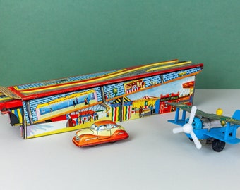 3 Vintage Mid Century Litho Clockwork Tin Toys, Foldout Fairground Race Track Arcade Technofix British, W German Toy Car, Japanese Plane