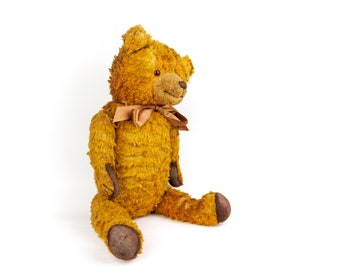 Oso de peluche alemán antiguo, articulado, grande, vintage, de pelo rizado marrón miel, de felpa de algodón, relleno duro, de mediados de siglo.