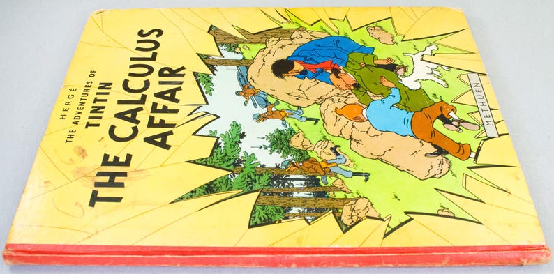 May include: A vintage copy of "The Calculus Affair" by Herg&eacute;, featuring a yellow cover with the title in bold black letters. The cover art depicts a dynamic scene with characters in action, set against a backdrop of trees and explosions. The book has a red spine.