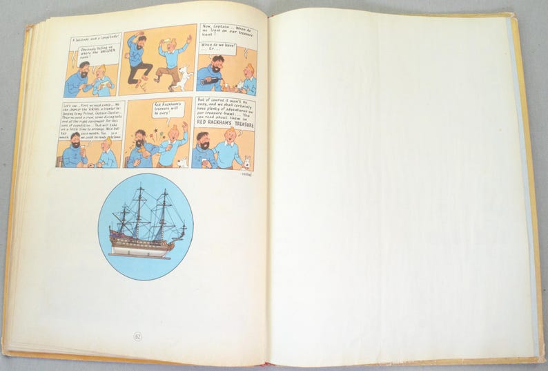 May include: Open book with a comic strip featuring cartoon characters in blue and white. A circular illustration of a tall ship is also present. The pages are yellowed with age, suggesting a vintage item.