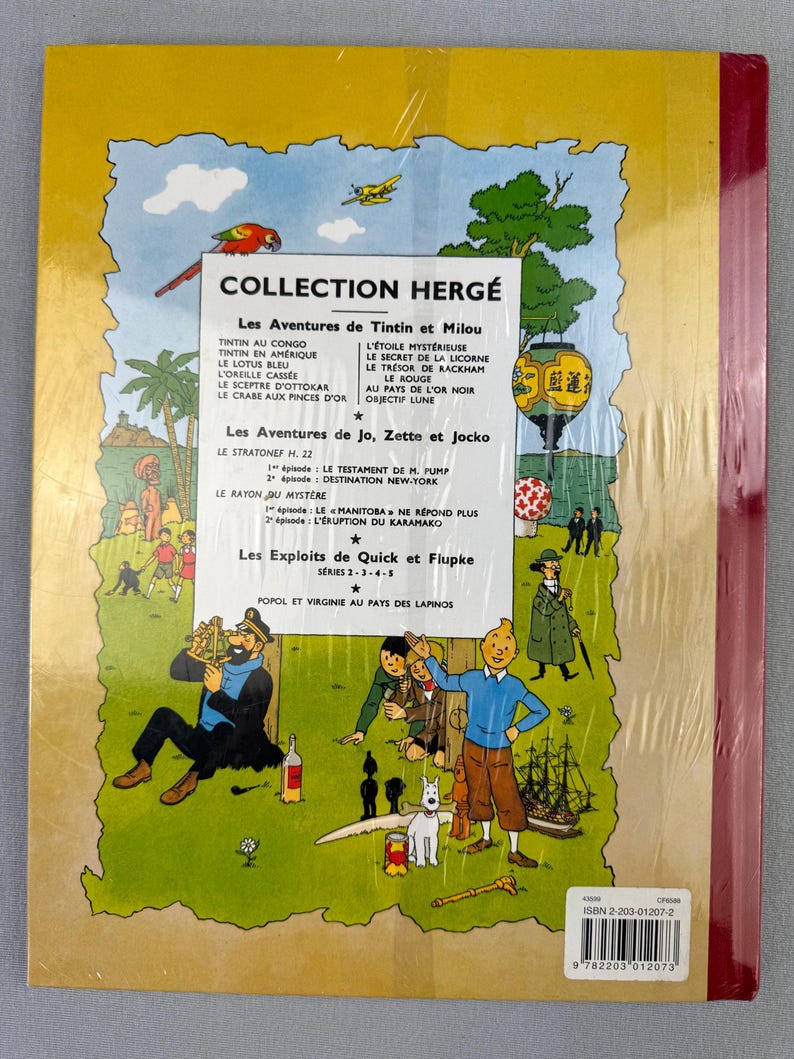 May include: A vintage hardcover book featuring the "Collection Herg&eacute;" series, with illustrations and text in French. The cover displays various Tintin adventures, including "Tintin in America" and "The Secret of the Unicorn." The book is wrapped in clear plastic.