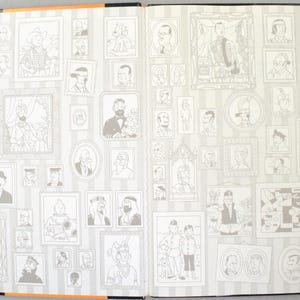 May include: Open book spread featuring numerous framed illustrations of characters, set against a striped background. The illustrations are in black and white, with varying sizes and styles. The book's edges are black, with an orange stripe.